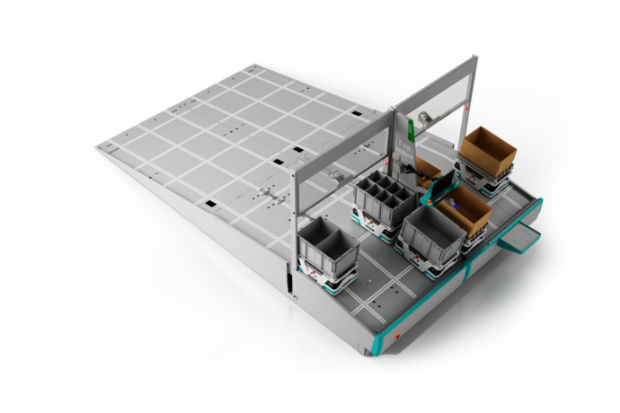 Kommissionierstation von oben zeigt mehrere autonome mobile Roboter mit Kartonagen auf Tablaren und Fullfilmentbehälter für das Store Replenishment